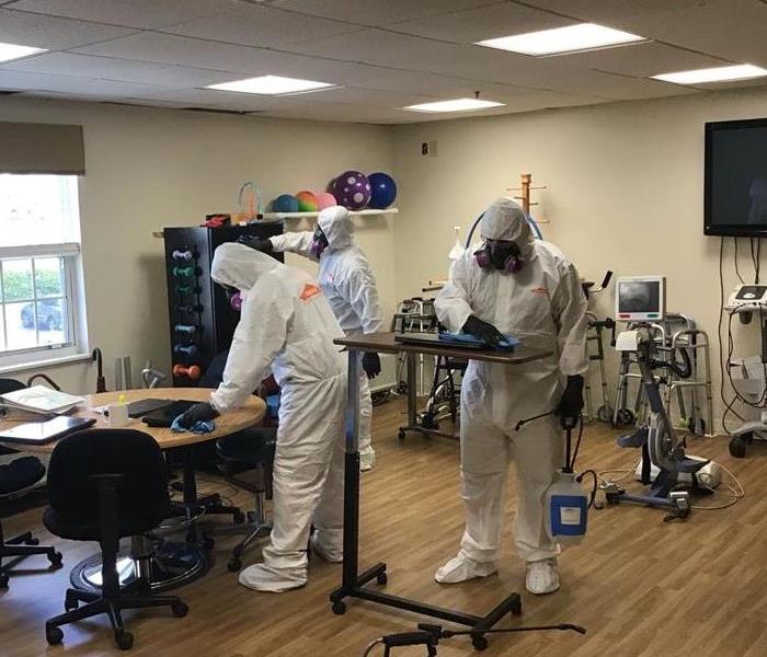 SERVPRO technicians in PPE at a commercial cleaning job